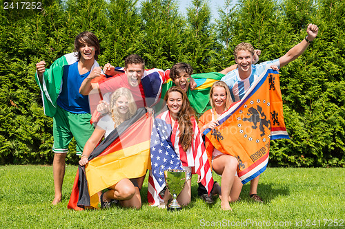 Image of International Athletes With Various National Flags Celebrating I