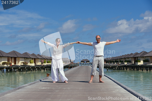 Image of happy young couple have fun on beach