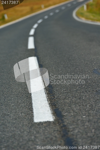 Image of road through the green field