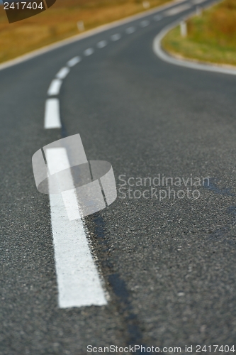 Image of road through the green field