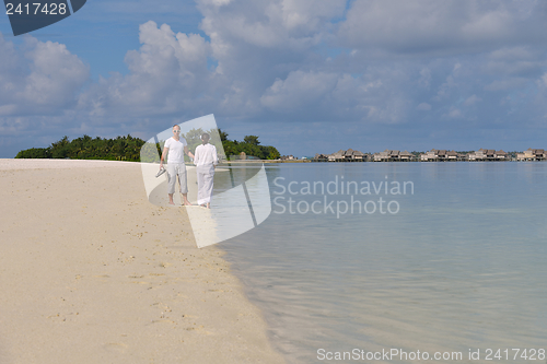 Image of happy young couple have fun on beach
