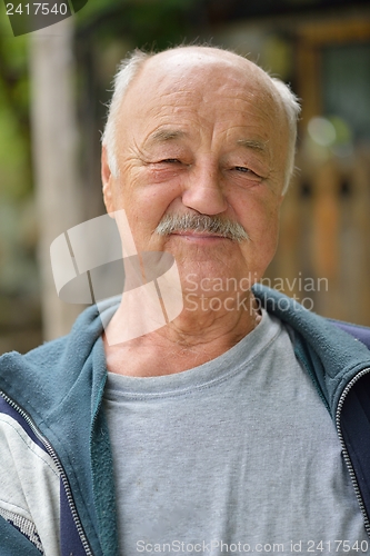 Image of Portrait of smiling elderly man