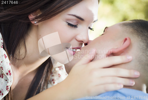 Image of Mixed Race Romantic Couple Portrait in the Park