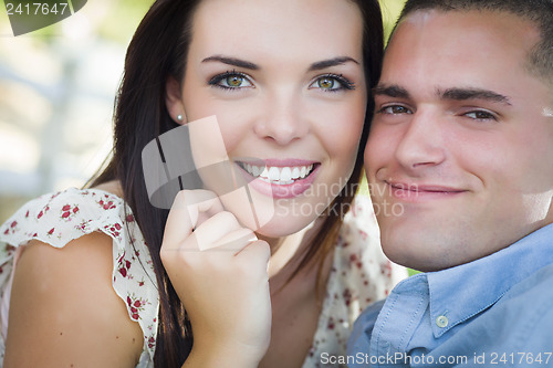 Image of Mixed Race Romantic Couple Portrait in the Park