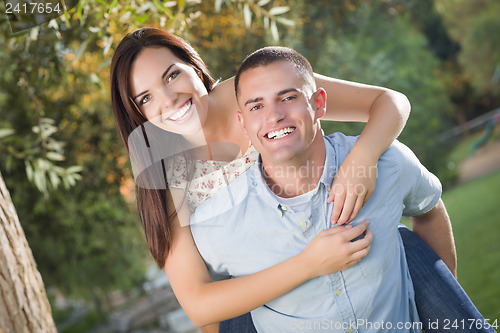Image of Mixed Race Romantic Couple Portrait in the Park