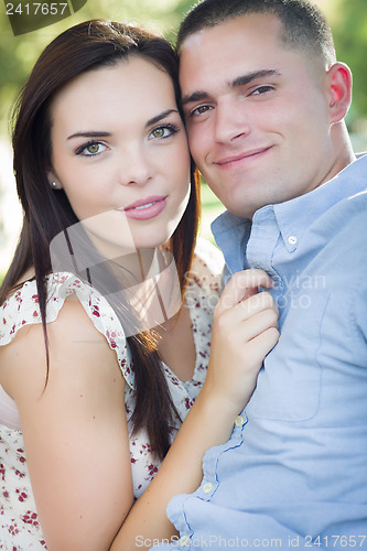 Image of Mixed Race Romantic Couple Portrait in the Park