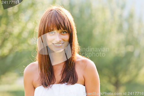 Image of Summer portrait of young smiling woman