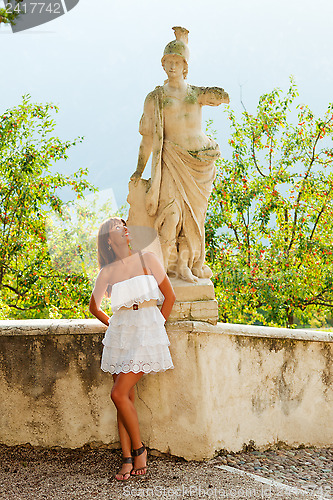 Image of Woman and statue of warrior