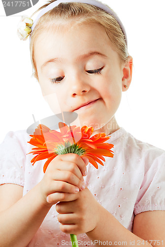 Image of Funny little girl with flower