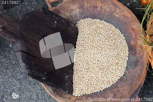 Image of Wooden spoon and wheat