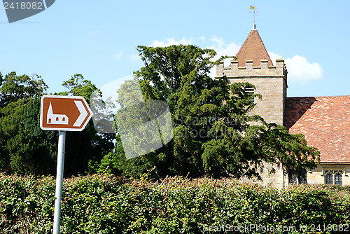 Image of Tourist sign points towards historic church