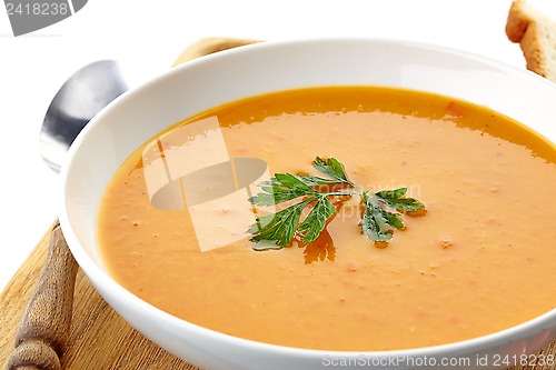 Image of squash soup in a white plate