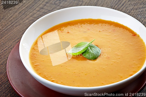 Image of squash soup with basil leaf