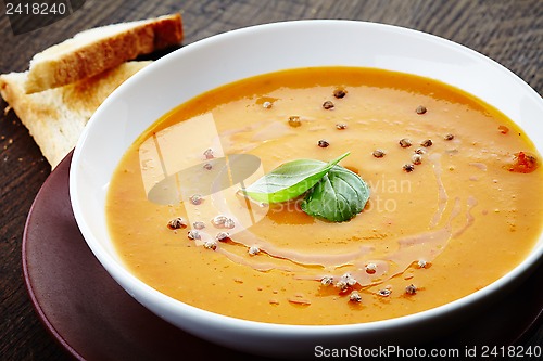 Image of squash soup with basil leaf