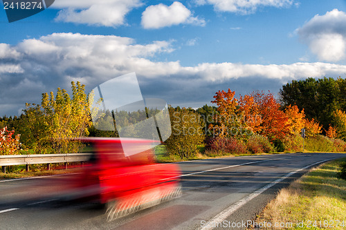 Image of The fast car on the road