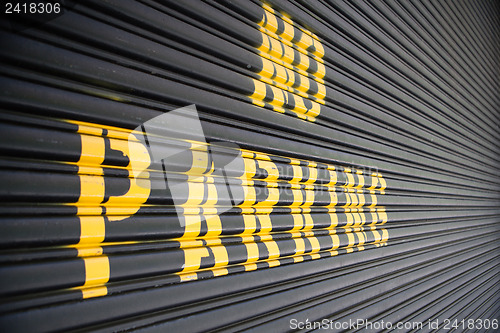 Image of No parking - yellow sign on the garage