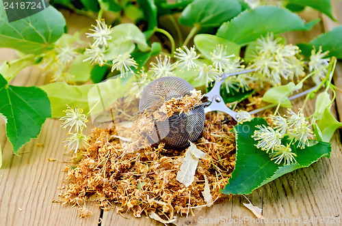 Image of Herbal tea from dry linden flowers in a tea strainer