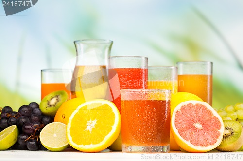 Image of glasses of juice, fruits