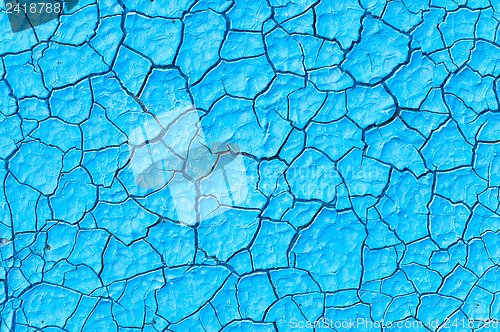 Image of cracked blue paint surface as grunge background