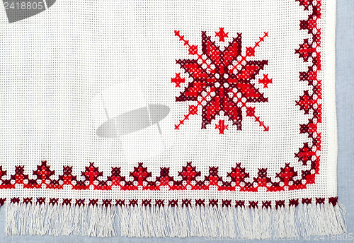 Image of embroidered handmade good by cross-stitch pattern