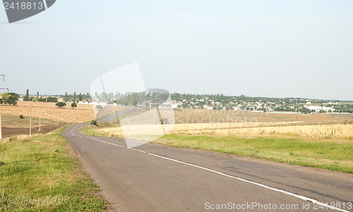 Image of a turn of rural road is to the right