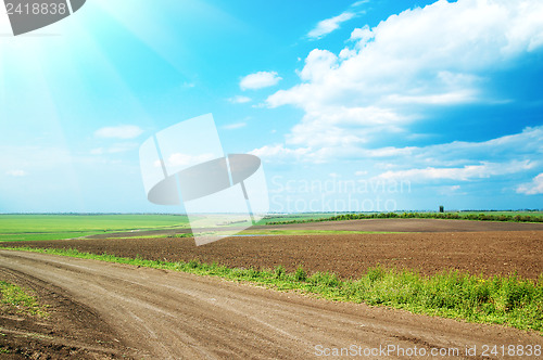 Image of dirty road under cloudy sky