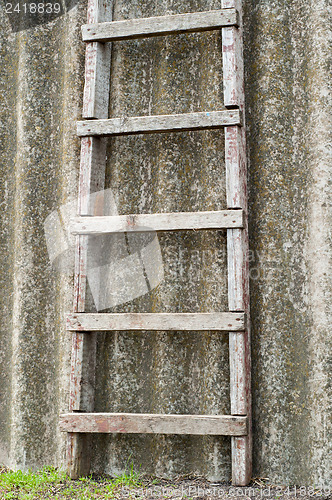 Image of wooden ladder near old roofing slate