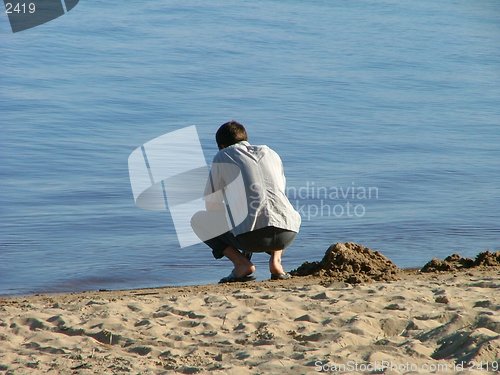 Image of lonely guy in the beach