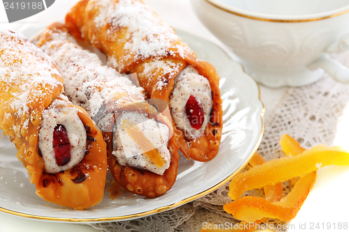 Image of Cannoli with fresh ricotta and candied fruit.