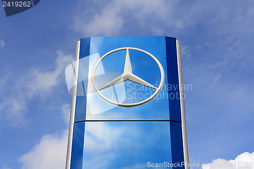 Image of Mercedes-Benz Sign against Blue Sky