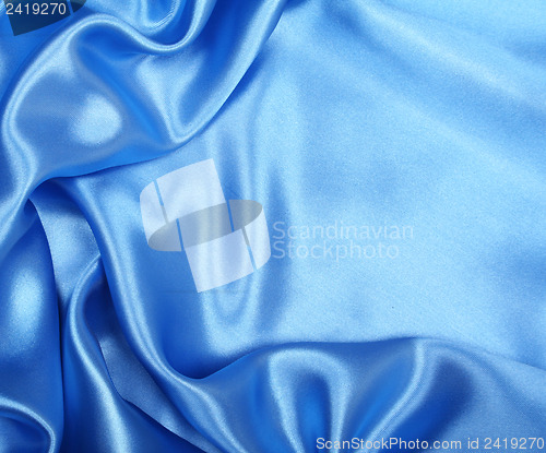 Image of Smooth elegant blue silk as background 