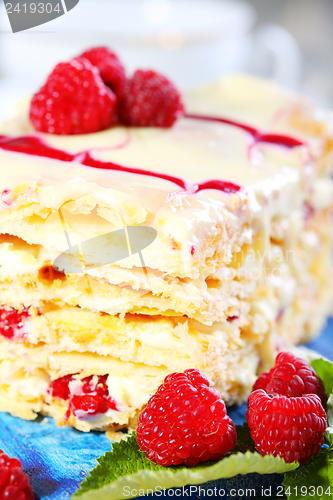 Image of Cream cake with white chocolate and raspberries.