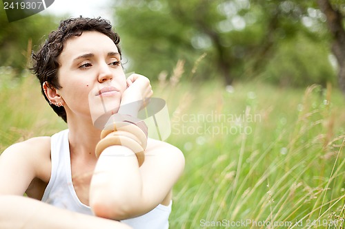 Image of cute girl on green field 