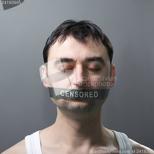 Image of man with bandage on face