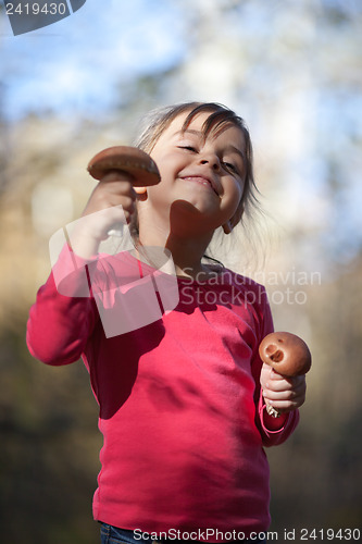 Image of Little girl with mushrooms