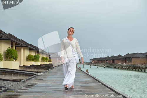 Image of young woman relax on cloudy summer day