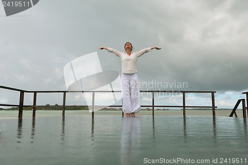 Image of young woman relax on cloudy summer day