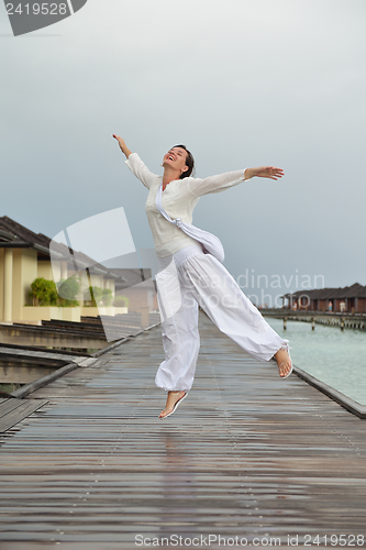 Image of young woman relax on cloudy summer day