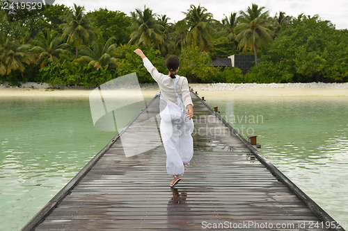 Image of young woman relax on cloudy summer day