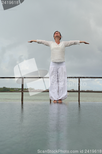 Image of young woman relax on cloudy summer day