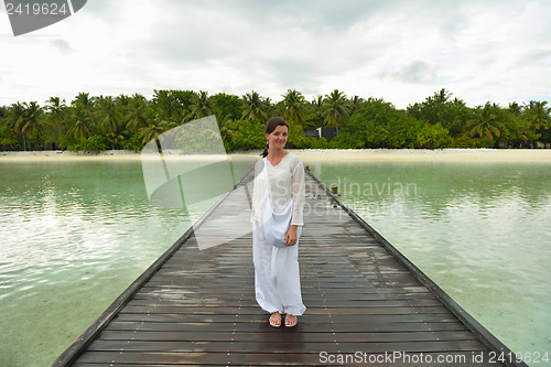 Image of young woman relax on cloudy summer day