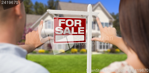 Image of For Sale Sign, House and Military Couple Framing Hands