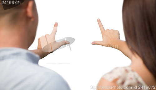 Image of Military Couple with Framing Hands Slightly Blurry on White