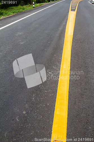 Image of yellow line on the road texture background