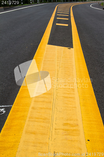 Image of yellow line on the road texture background