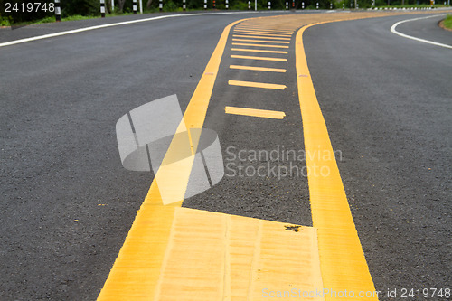 Image of yellow line on the road texture background
