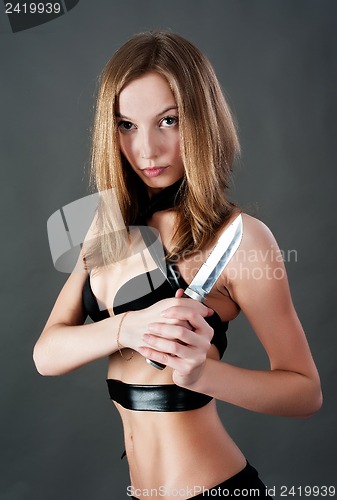 Image of Pretty girl with knife