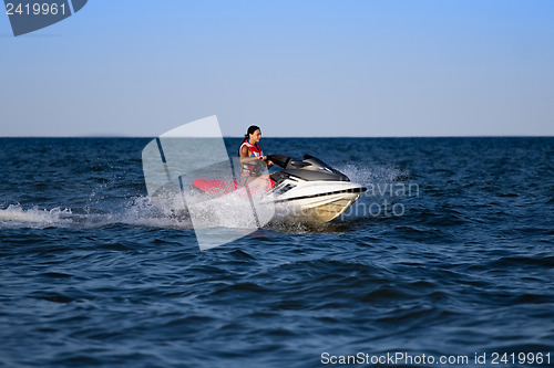 Image of Brunette on a jetski