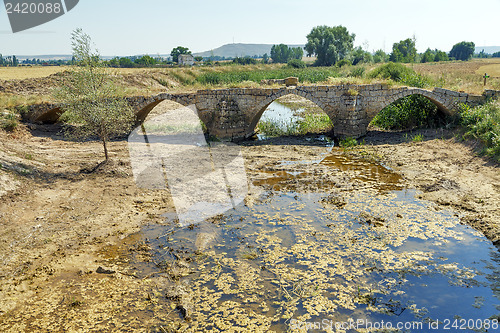 Image of Roman bridge over the river Brulles Trisla in Sasamon