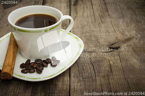 Image of Coffee Cup with beans and cinnamon stick